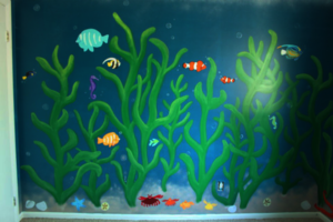 Nursery wall painting of sea kelp and underwater life